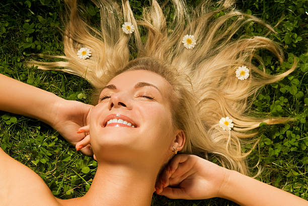 istock Young woman relaxing on a meadow 92036841
