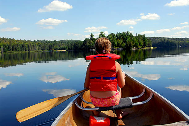 istock A child in a canoe in the water 92037015