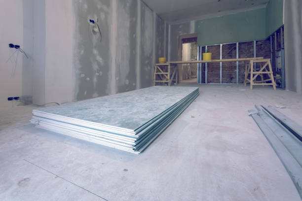 istock Working process of installing metal frames and plasterboard (drywall) for gypsum walls and materials are in apartment is under construction, remodeling, renovation, extension, restoration and reconstruction 920370886