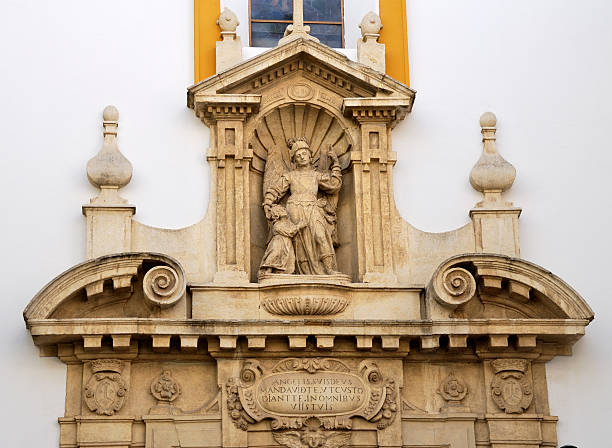 View of a statue located in the courtyard of the historic Parish of San Miguel in Cordoba. The image captures artistic and architectural details, highlighting the sacred and traditional atmosphere of the courtyard, a symbol of Andalusian culture and religiosity in the Spanish city.