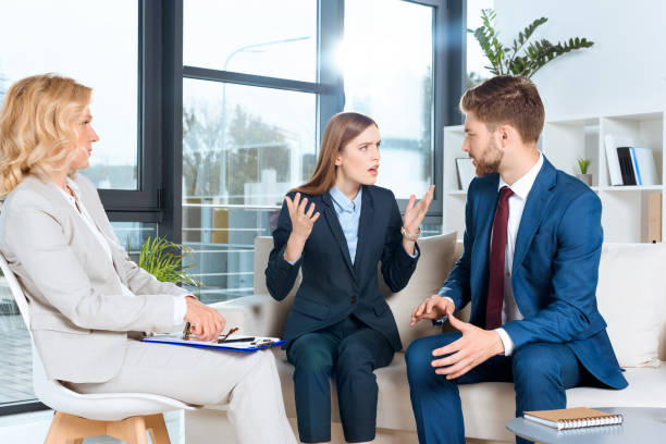 istock young couple and psychologist 920375552
