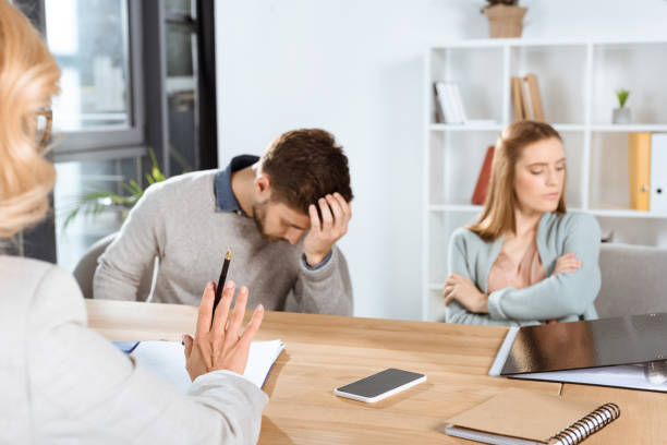 istock young couple and psychologist 920377950