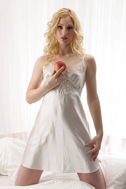Portrait of young attractive woman sitting comfortable in the room and smiling.