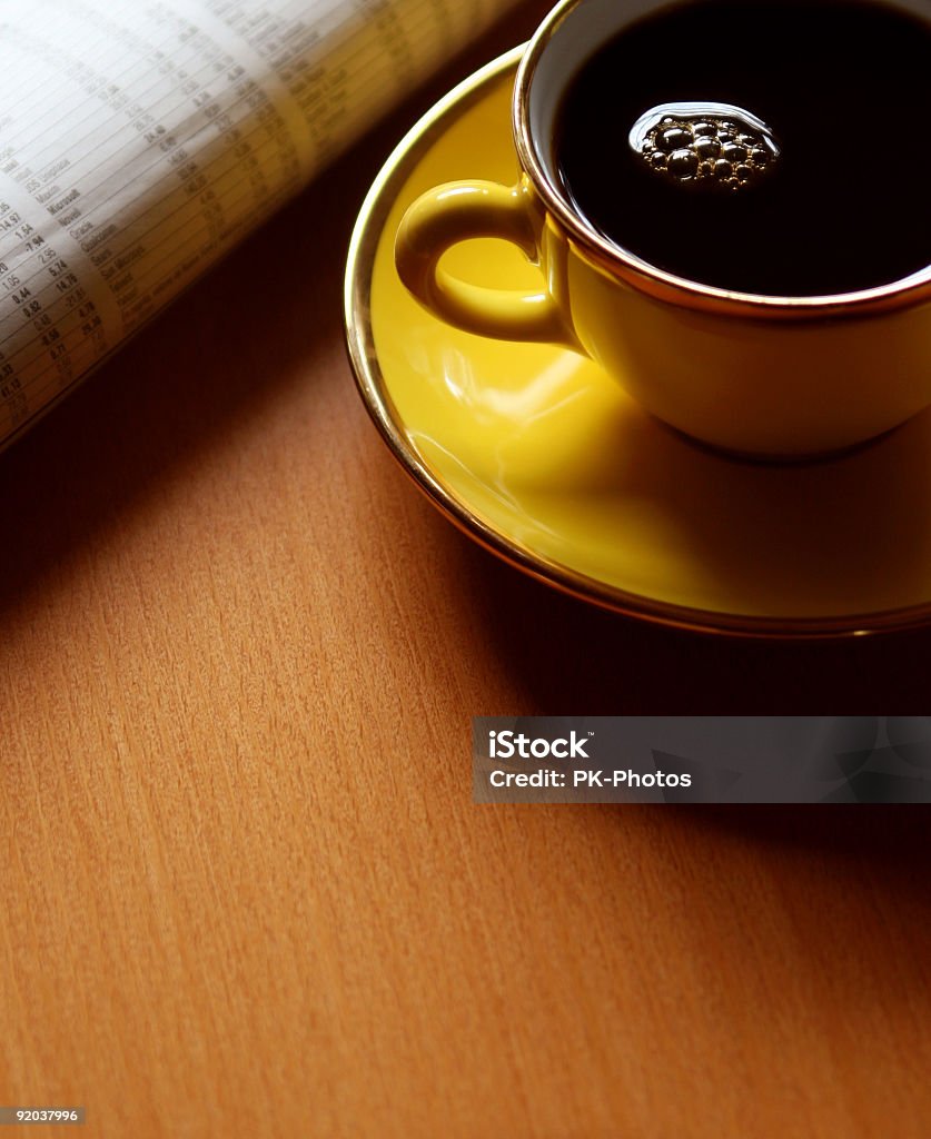 Coffee and Newspaper yellow coffee cup and stock news on table, copy space Coffee - Drink Stock Photo