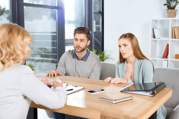 istock young couple and psychologist 920382288