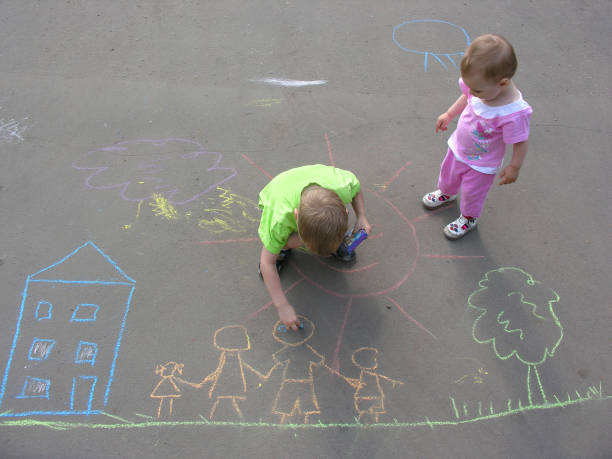 istock children drawing on asphalt family house 92038307