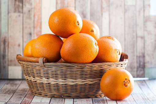 Basket with juicy oranges. Fruits, organic vegetarian food
