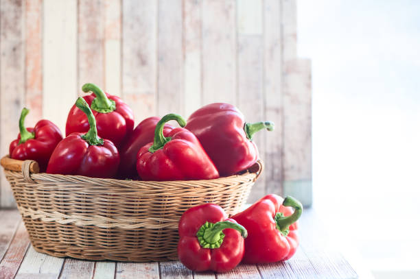 istock Basket with juicy red bell pepper on natural rustic background 920387452