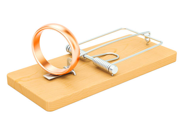 istock Mousetrap with wedding rings, 3D rendering isolated on white background 920387612