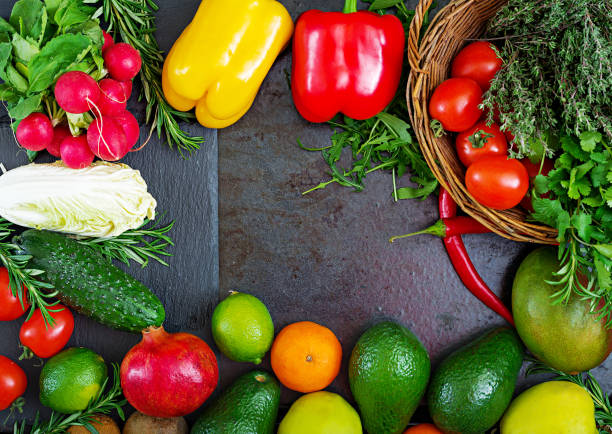 istock Composition with assorted raw organic vegetables and fruits. Detox diet. Top view 920387648