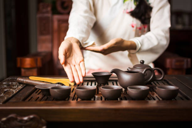istock Woman offering traditionally prepared Chinese tea 920392638