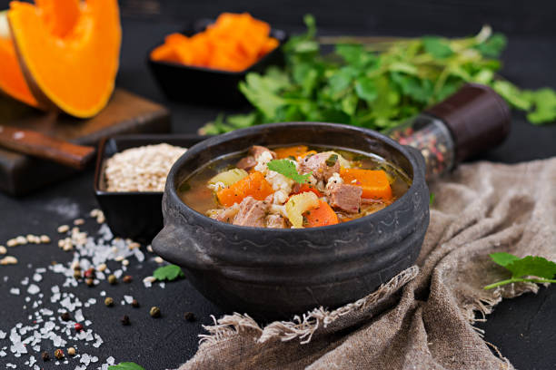 thick soup with beef, pearl barley, pumpkin and celery. dietary menu. - portion pumpkin vegetable black imagens e fotografias de stock