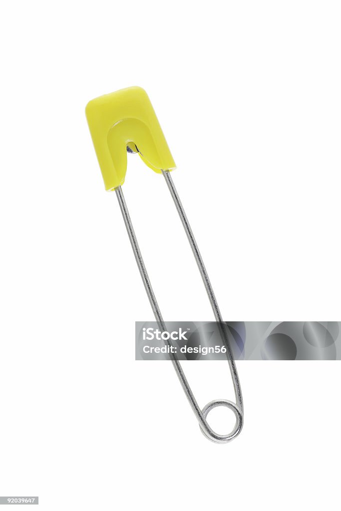 Safety pin in yellow  Diaper Stock Photo
