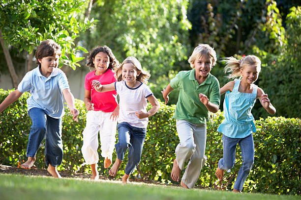 istock Five young friends running outdoors 92039710