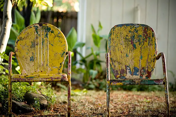 Photo of two vintage 50's metal chairs in autumn