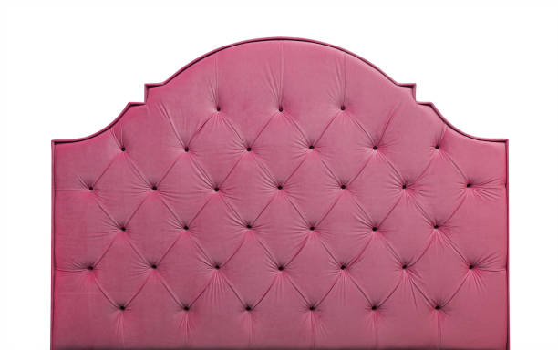 istock Pink velvet bed headboard isolated on white 920405756