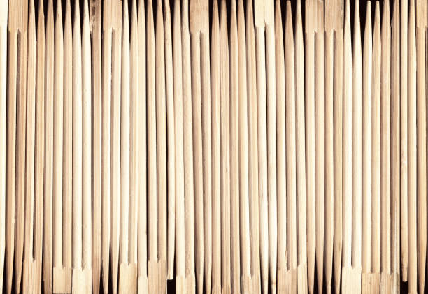 Many Asian wooden chopsticks arranged in a row background