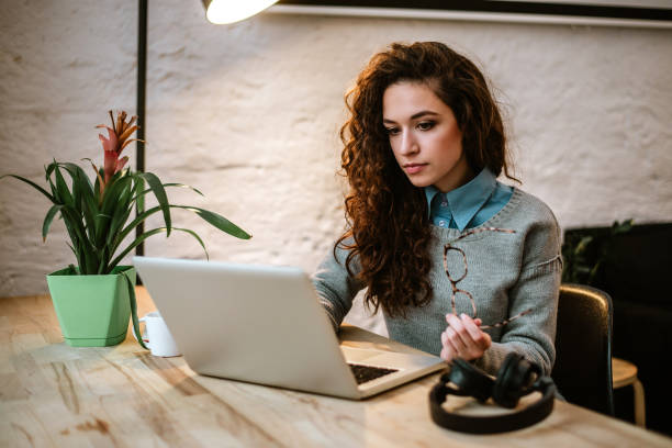 istock Student learning online with a laptop in a desk at home. 920406658