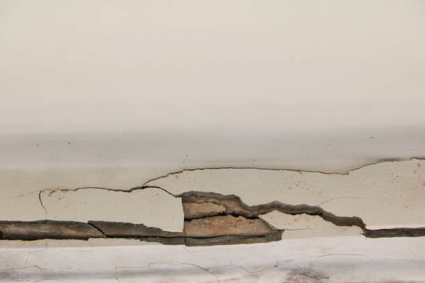 istock concrete cement texture wall  with crack in building old background 920409064