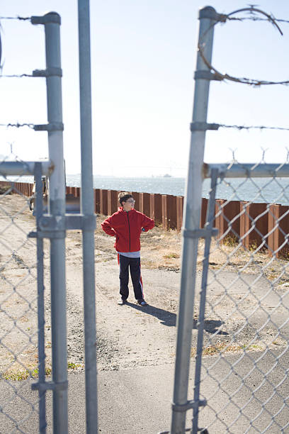 istock Boy on the Other Side of Fence 92041154
