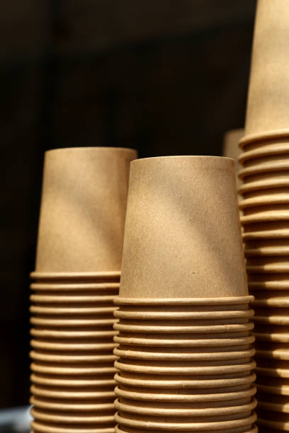 istock Stack of brown coffee paper cups close up 920418456