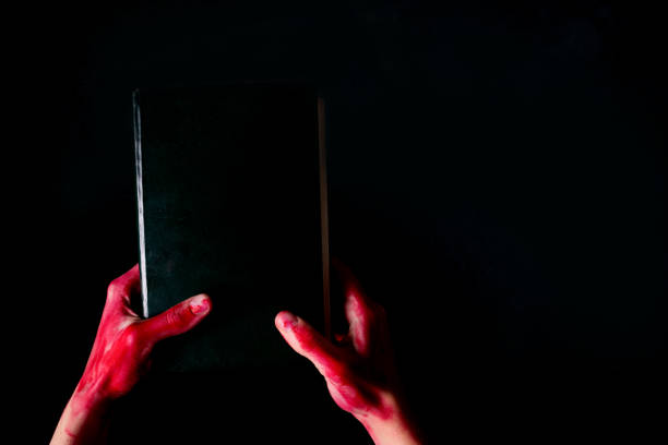 istock Alchemy book with bloody hand 920418822