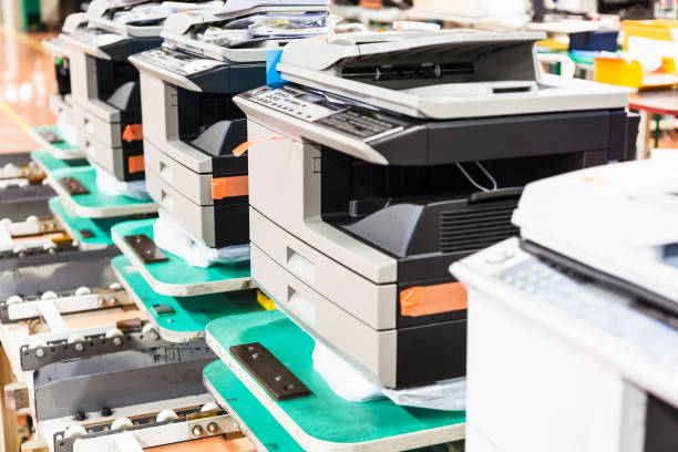 istock new assembled copiers in line in factory 920424064