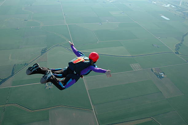 Royalty Free Stock Photo: Woman Skydiving - I Can Fly!  skydiving stock pictures, royalty-free photos & images
