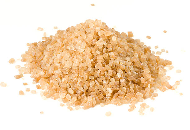 istock Heap of brown cane sugar isolated on white 92042622