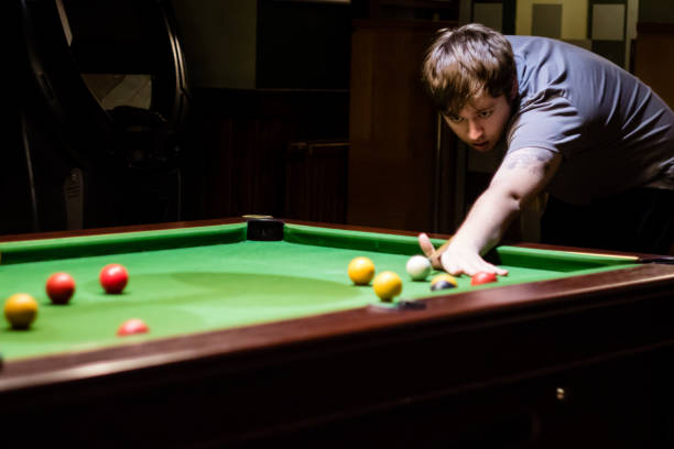 istock A man preparing to play a pool shot, taken from the front 920427126