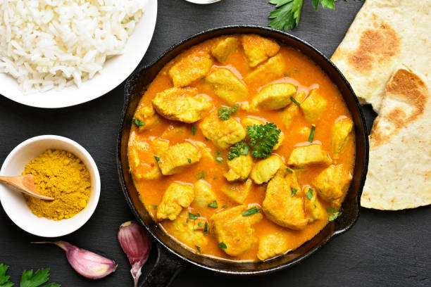 Chicken curry Indian chicken curry on black stone background. Top view, flat lay stew photos stock pictures, royalty-free photos & images
