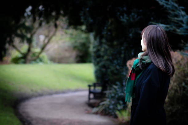 istock A beautiful young lady looking down a path, with copy space on the left 920427316