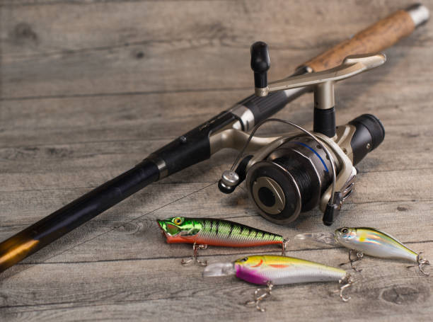 istock fishing tackle on a wooden table 920427350