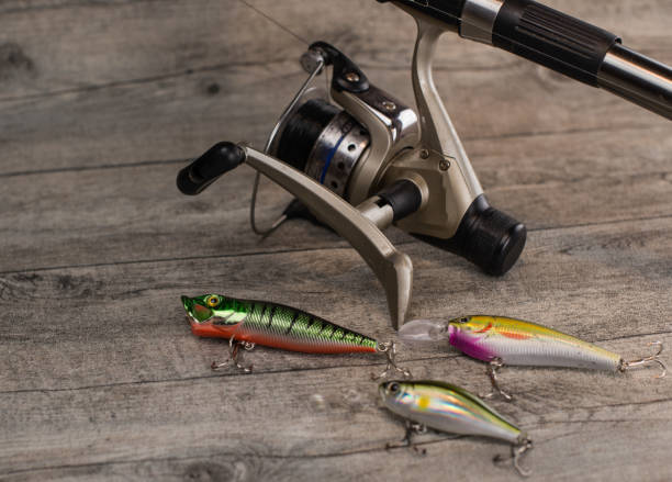 istock fishing tackle on a wooden table 920427378
