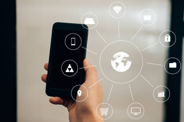 istock businessman holding smartphone & using app. man texting message outdoors. social network communication, wireless connection, lifestyle concept with internet of thing icon 920428704
