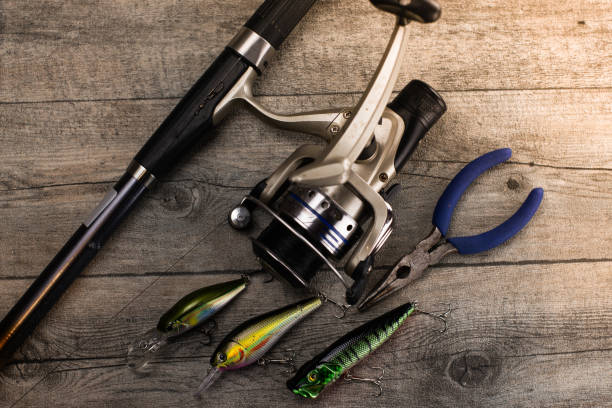 istock fishing tackle on a wooden table 920429118