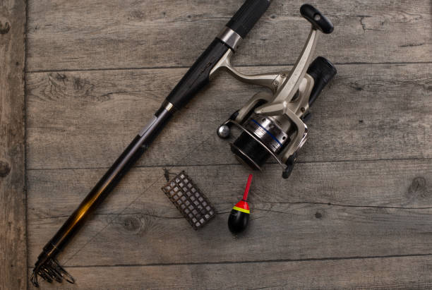 istock fishing tackle on a wooden table 920431878