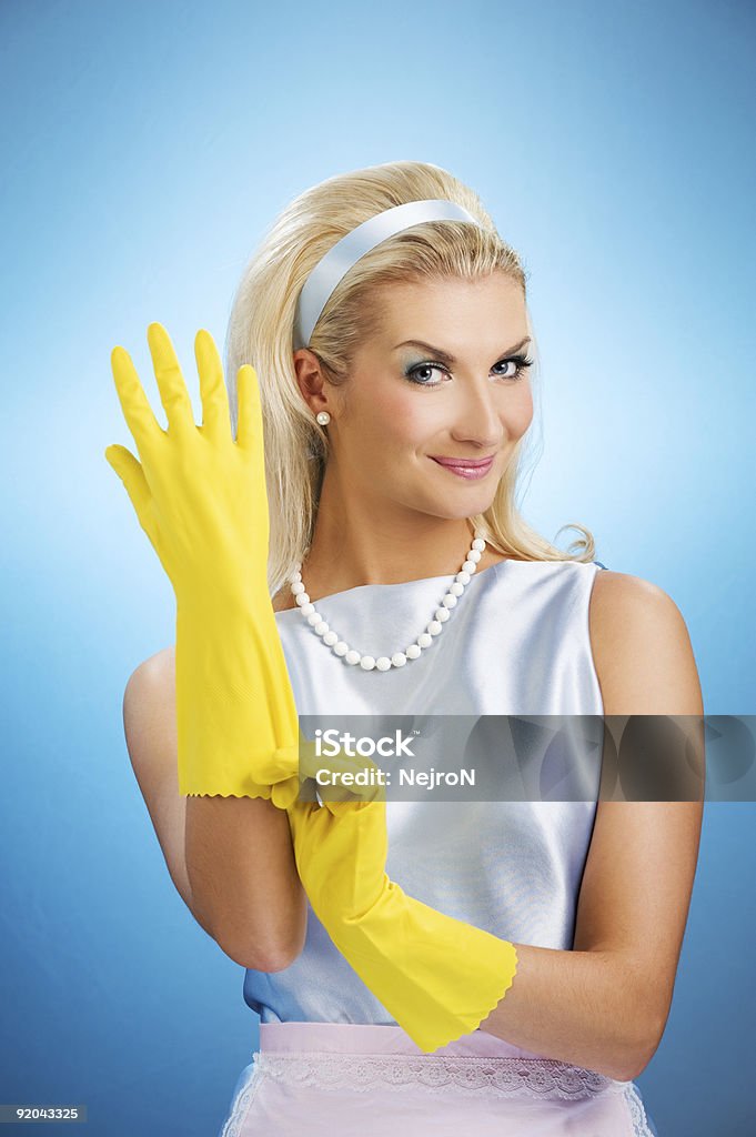 Beautiful happy housewife with rubber gloves  Retro Style Stock Photo