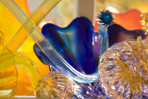 Coloured glass bowls for salad or dessert on the table.
