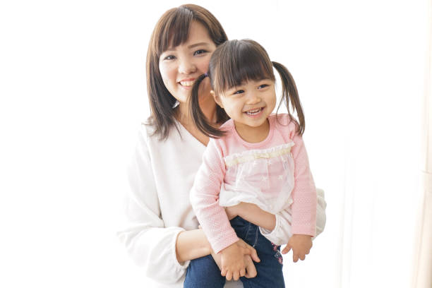 istock Mother having her child on her hip 920434504