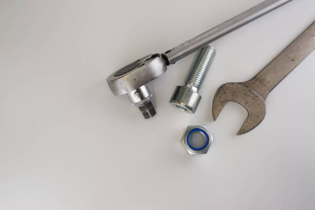 istock Torque wrench, spanners and nuts on white background 920440950