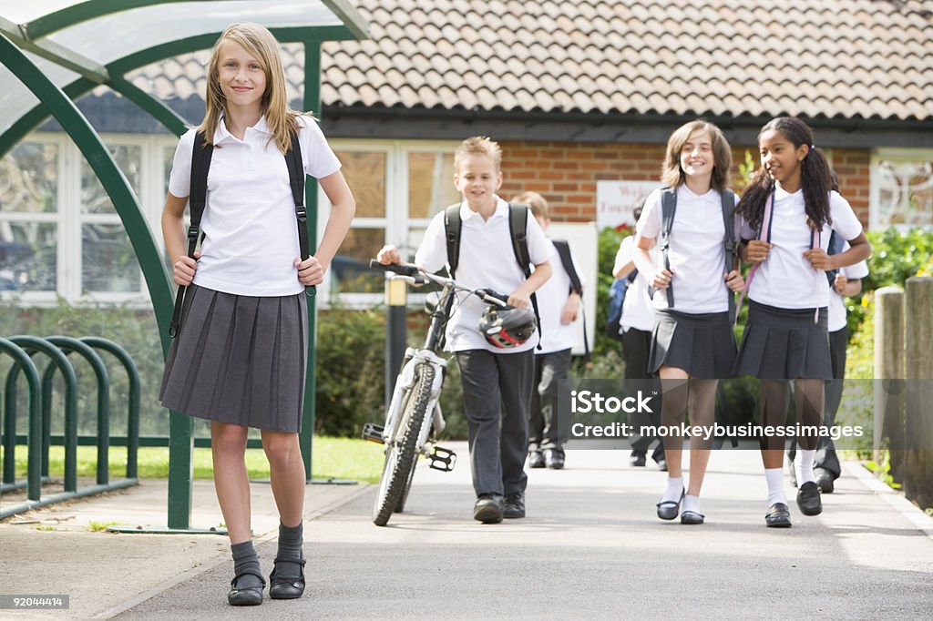 Junior children leaving school  Walking Stock Photo