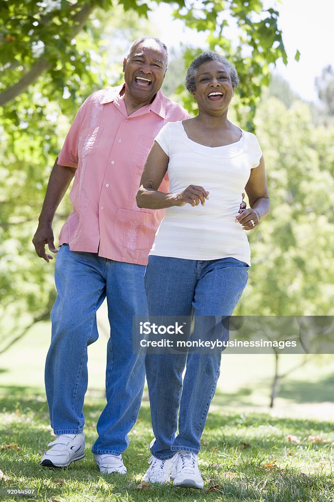 Senior couple having fun in park Senior couple having fun in park together Senior Adult Stock Photo
