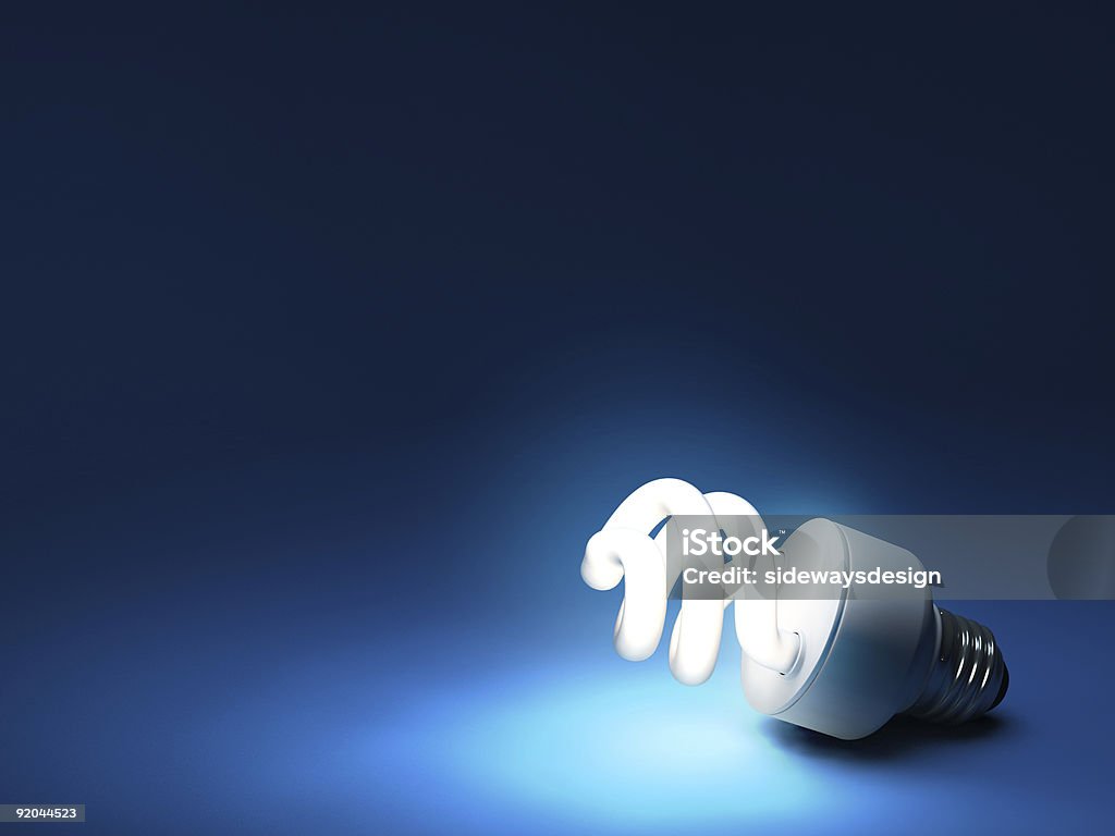 Compact Fluorescent Bulb - Resting on ground  Blue Stock Photo