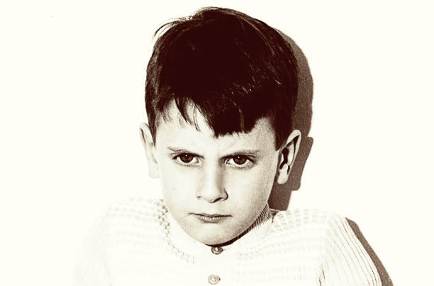 vintage grainy black and white angry boy portrait - 20th century style flash imagens e fotografias de stock