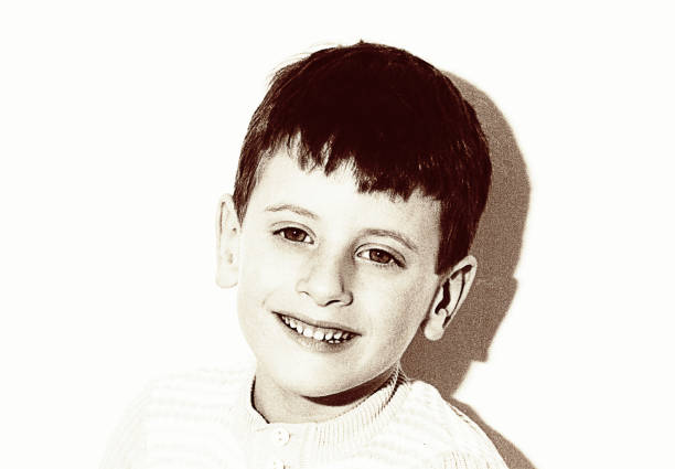 istock Vintage grainy black and white smiling boy portrait 920446096