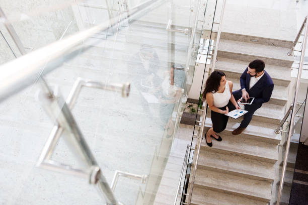 istock Two colleagues talk about work outside the office. Top view. 920454380