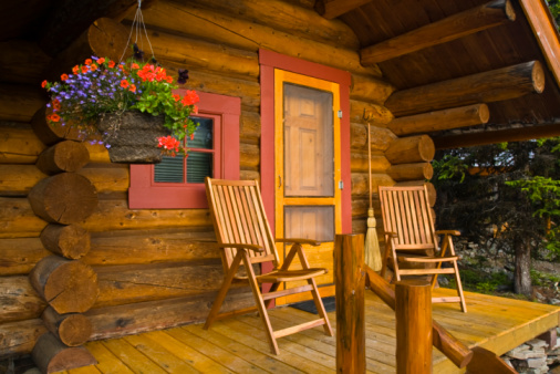 Close up detailed shot of a rustic log cabin in the canadian wilderness.