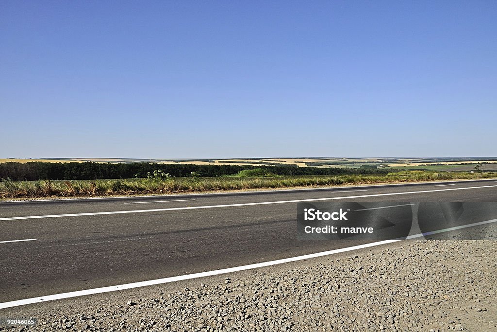 Highway, sky and fields Agricultural Field Stock Photo
