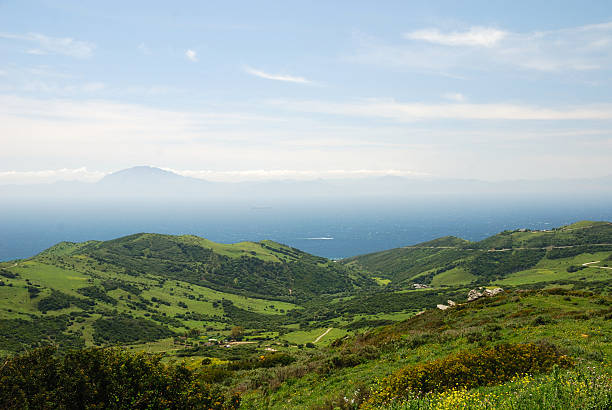 istock Green hills of Tarifa run down azure sea 92046490